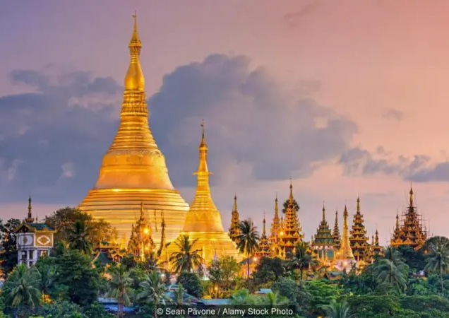 MYANMAR- GOLD LEAVES ADORN THE BUDDHA
